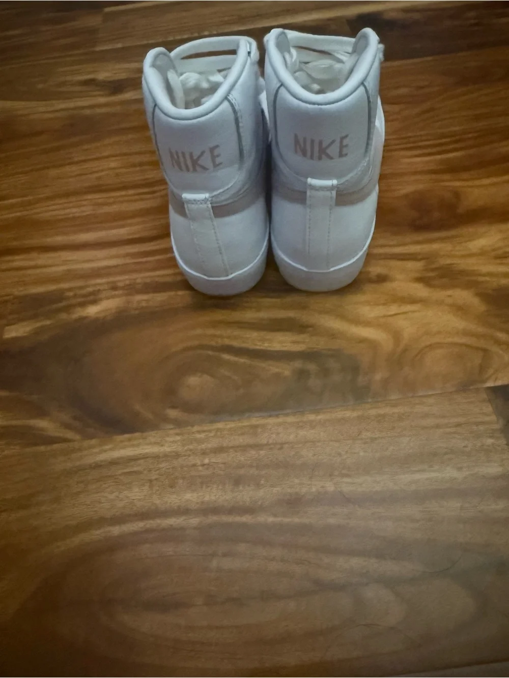 Nike White High-Top Sneakers with Pale Pink Swoosh